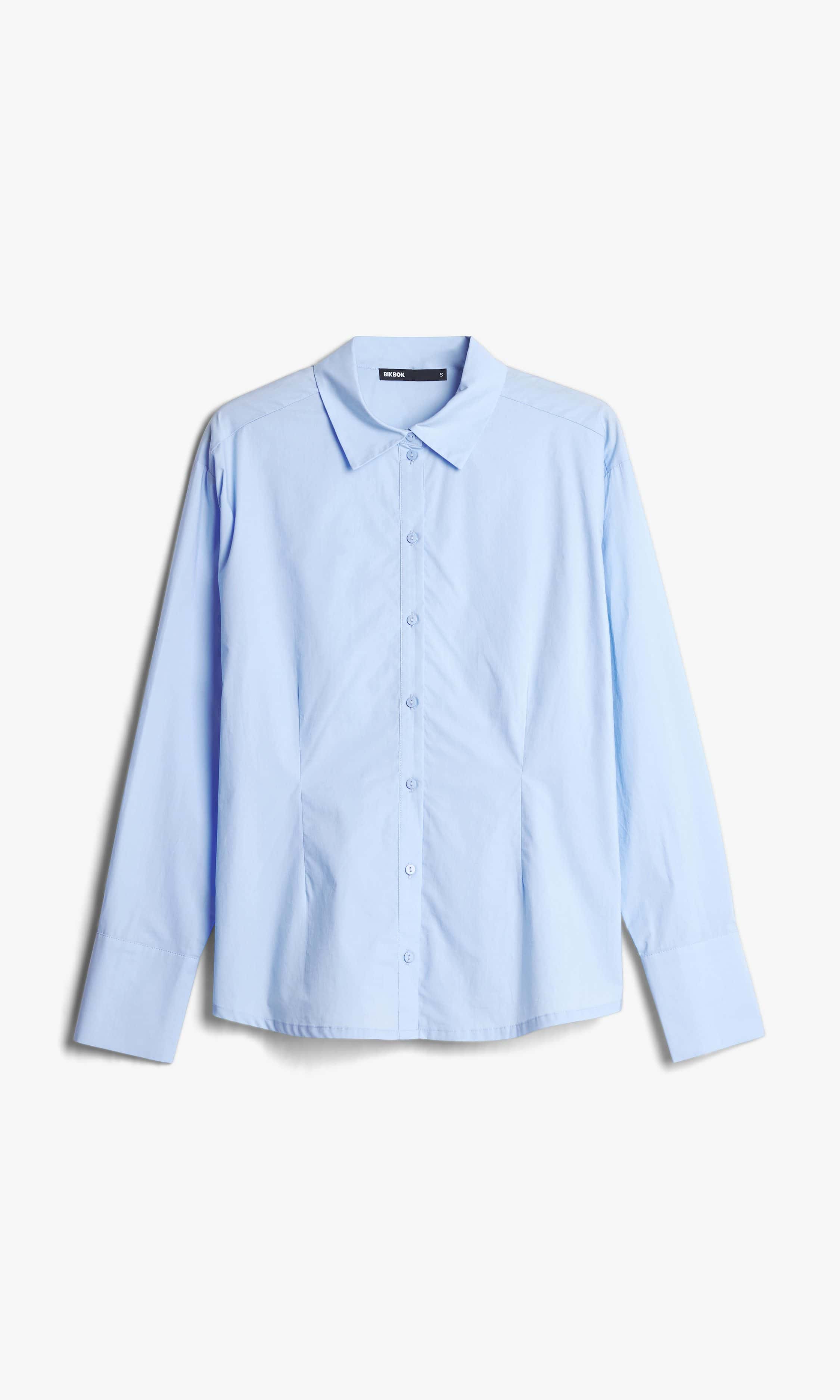 Ljusblå damskjorta med knytband