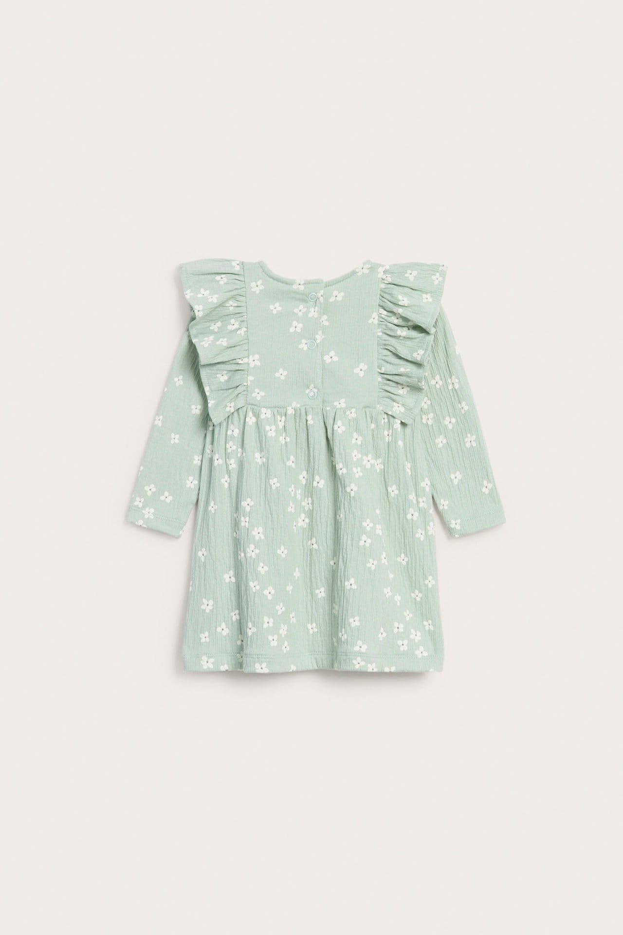 Ljusgrön babyklänning med volang