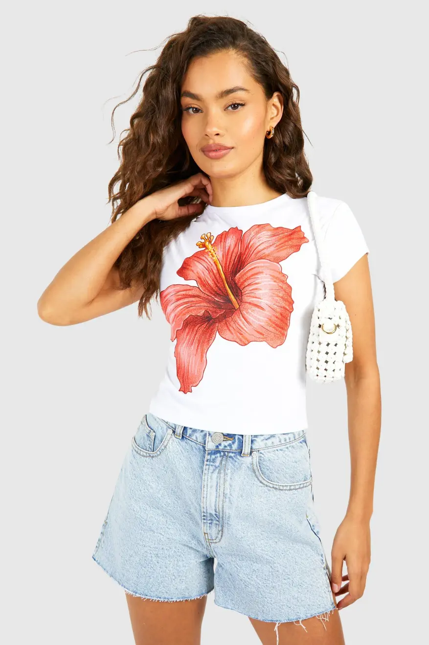 Vit blommig baby-T-shirt med kepsärm