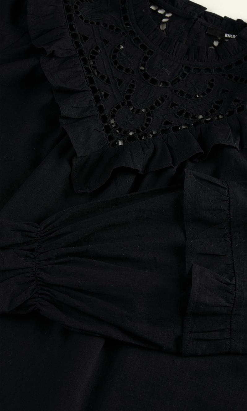 Svart Luna blus med eleganta volanger