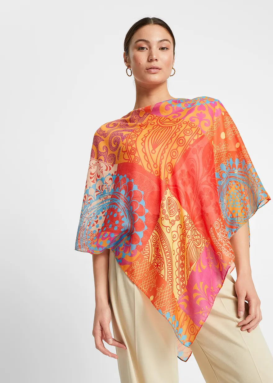 Sommarponcho i starkt mönstrat orange