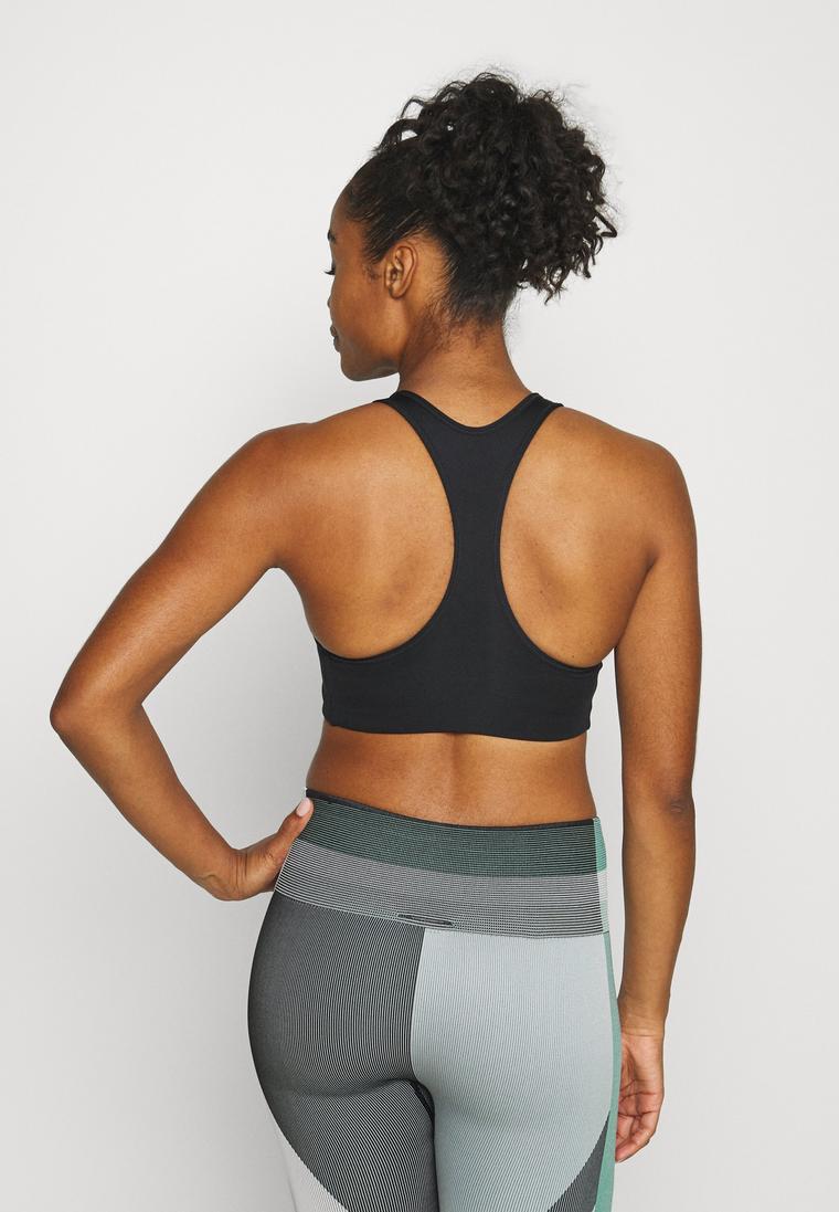 Nike Performance svart sport-bh hos Lounge by Zalando