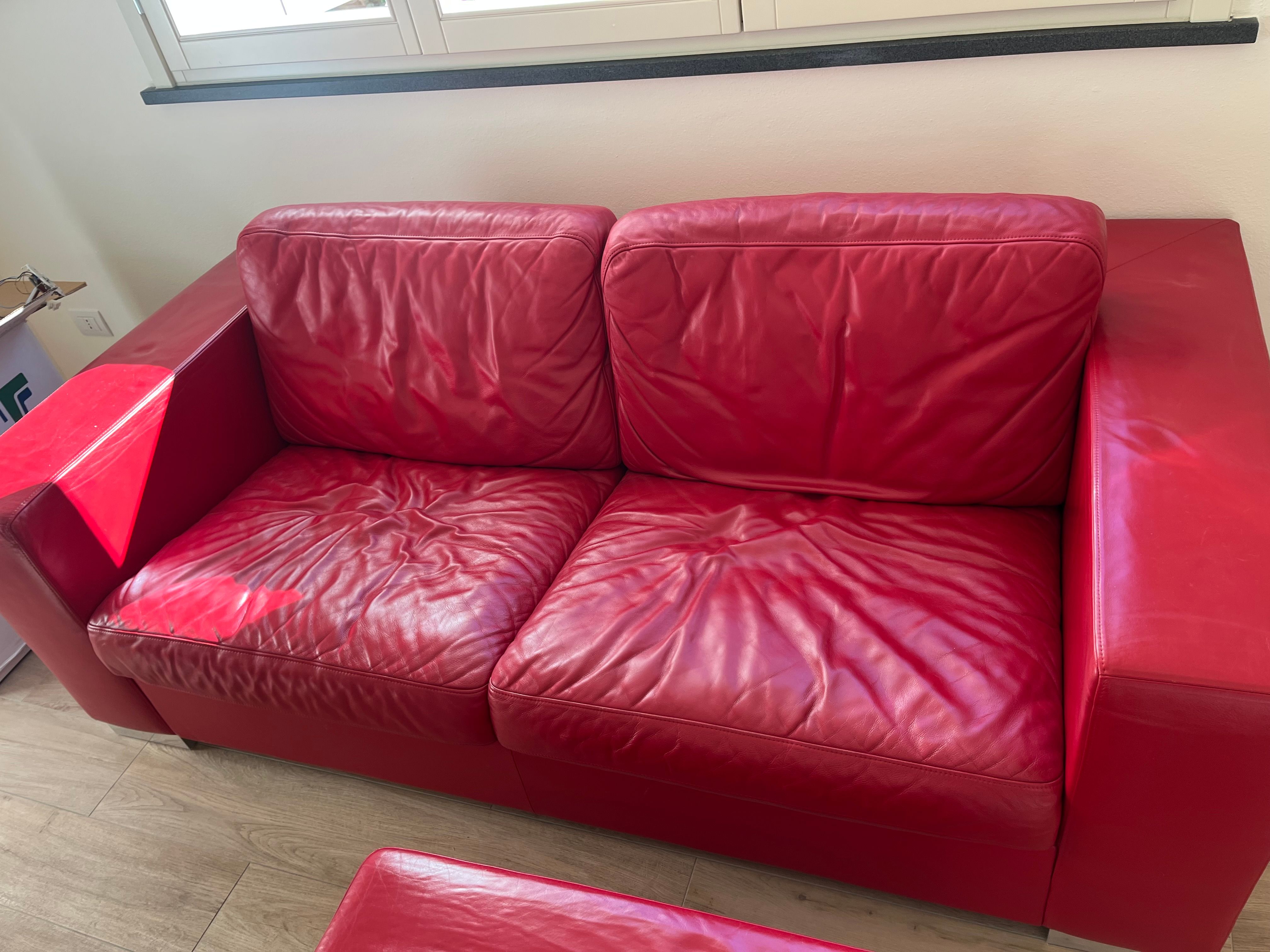 Set of 2 seater sofa and Massimo pouf upholstered in red leather, Poltrona Frau Front