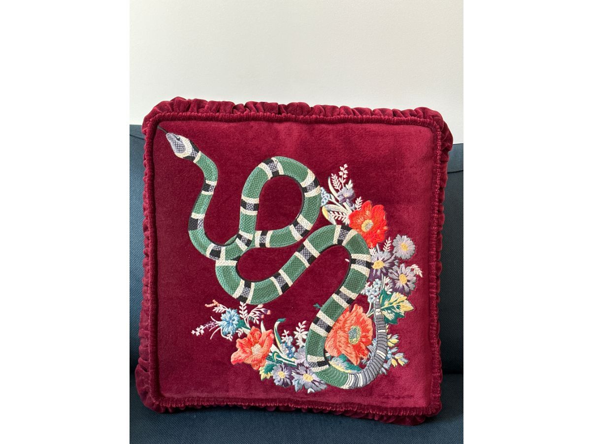 Red velvet cushion with decorations, Gucci