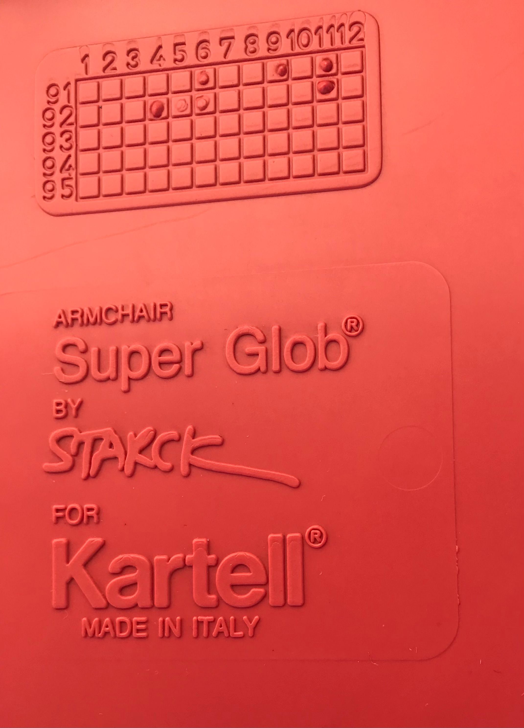 Poltroncina Super Glob rossa di Philippe Starck (anni '90), Kartell Brand