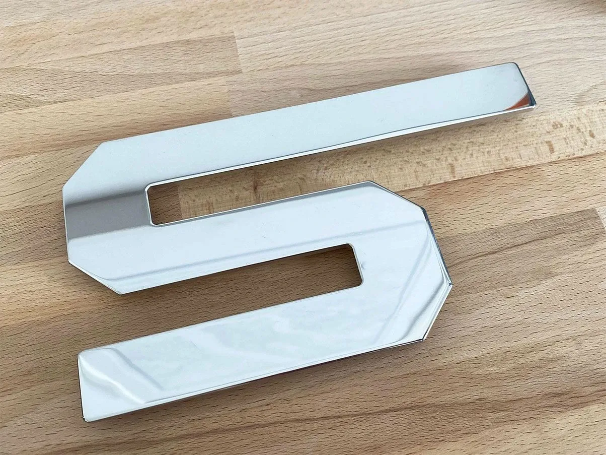 Trivet MH01 Segno for Esselunga in steel, Alessi 