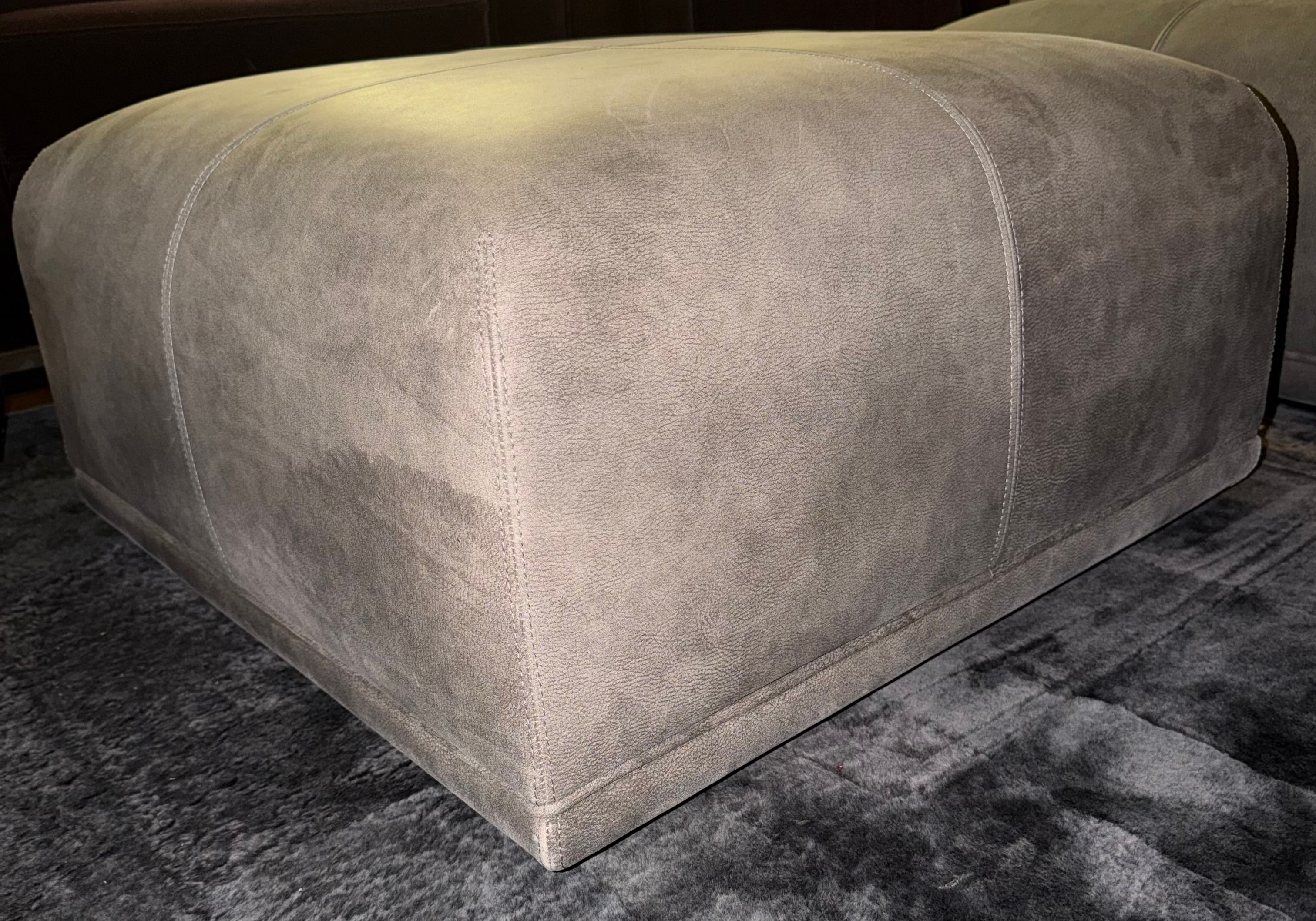 Pair of Amerigo leather ottomans Front