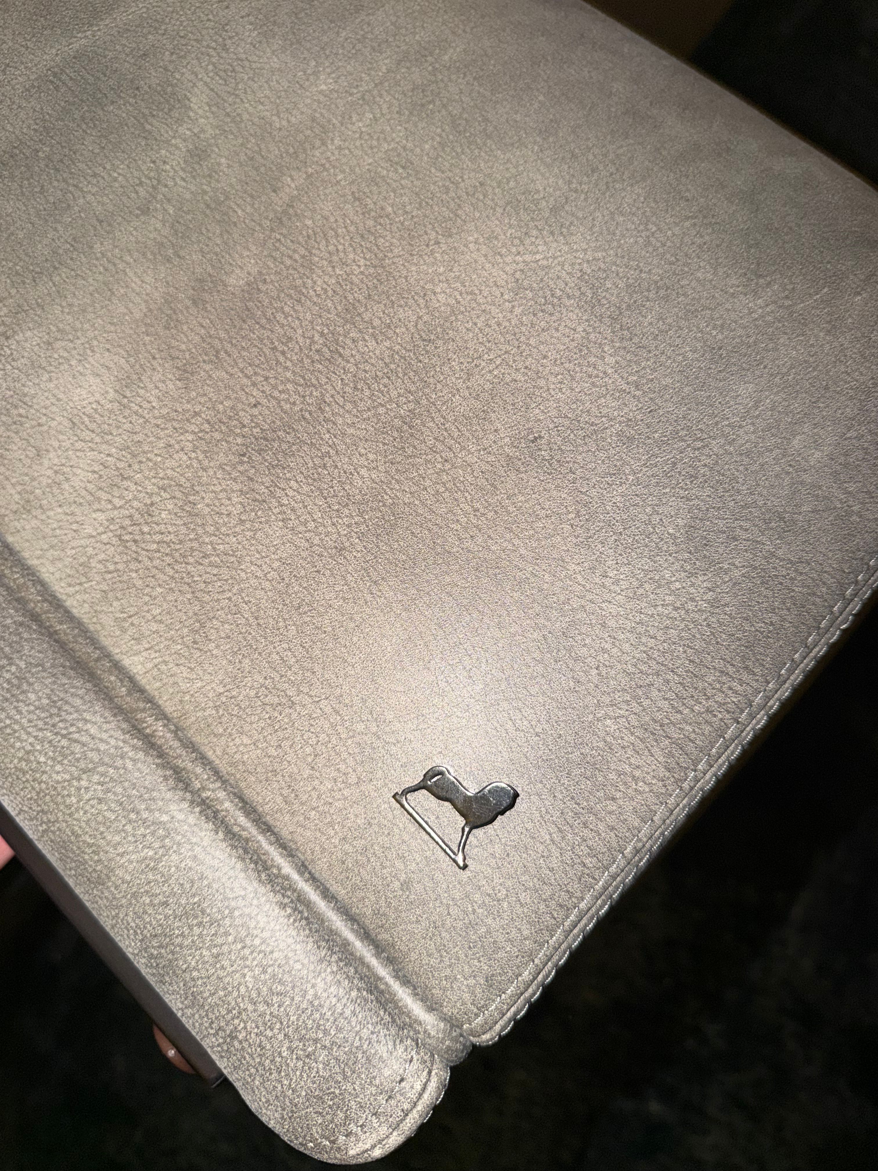 Pair of Amerigo leather ottomans Brand