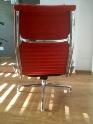 Red EA124 Lounge Chair by Charles and Ray Eames Side
