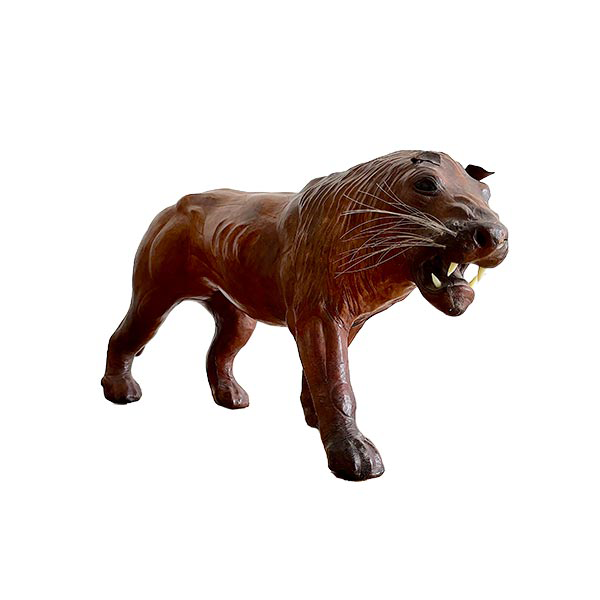 Lion-shaped statue in vintage leather and glass image