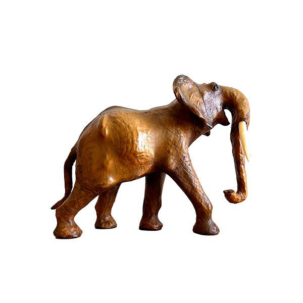 Vintage leather elephant statue with glass details image