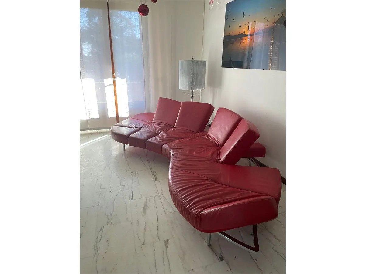 Flap sofa in red leather, Edra 2