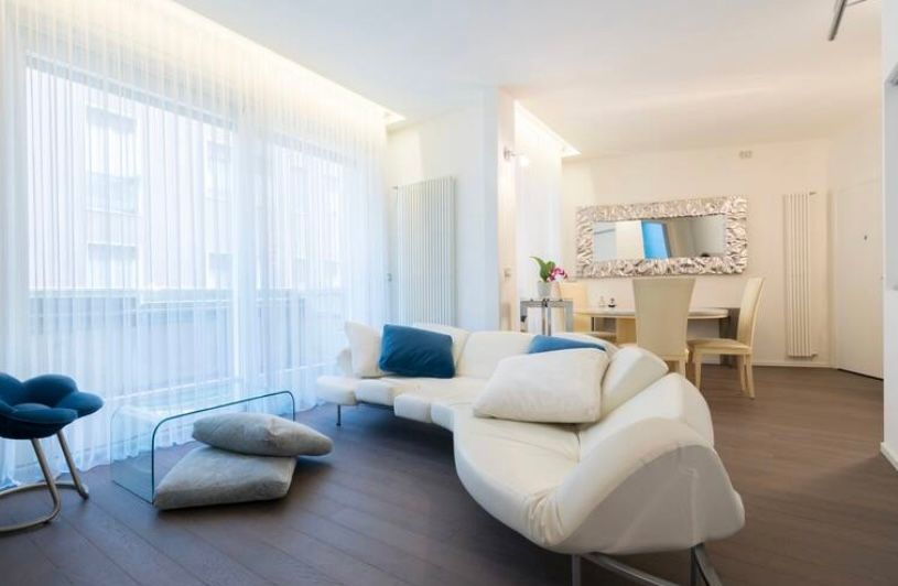 Flap sofa vintage in white leather by Francesco Binfaré Side