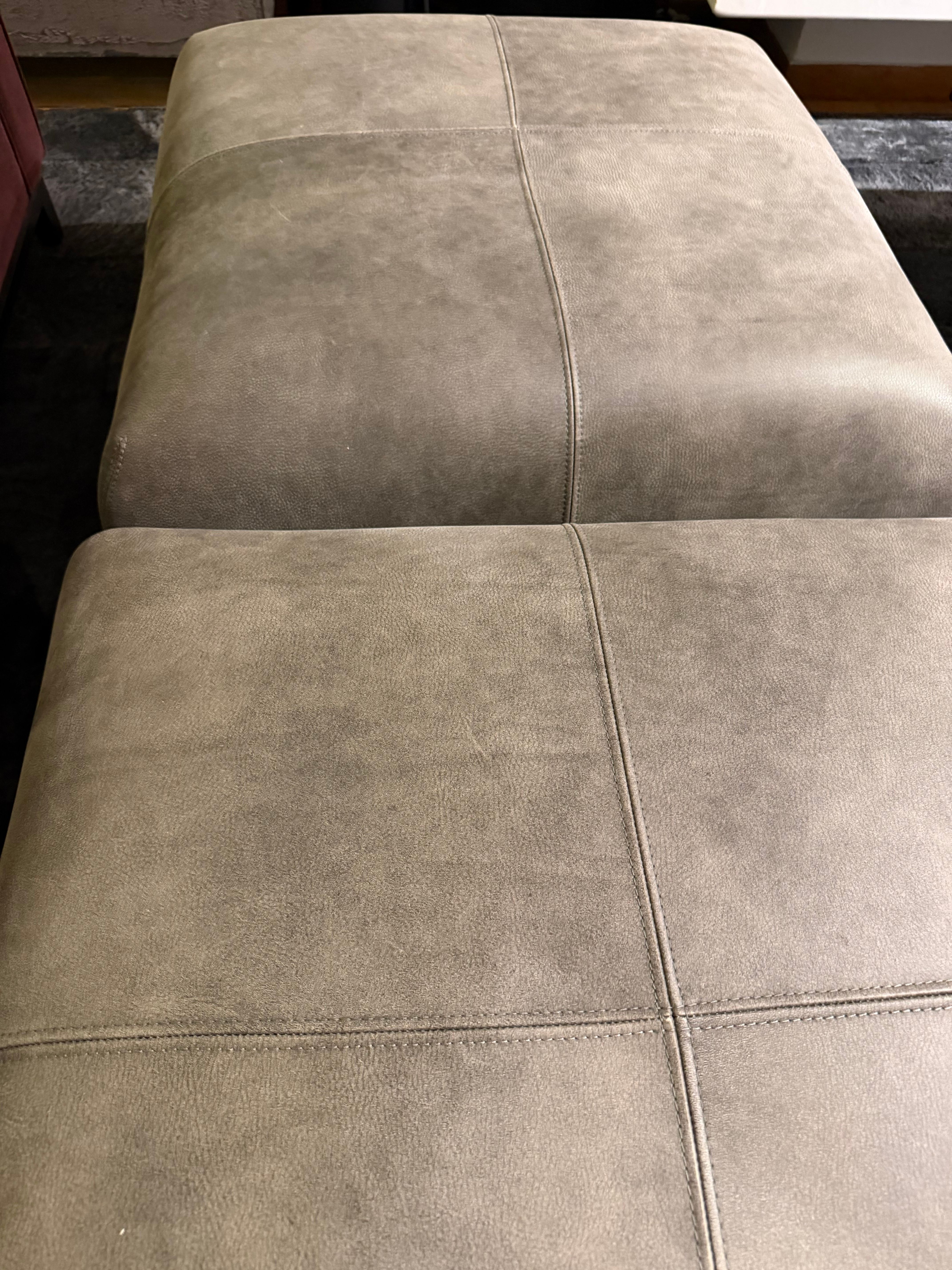 Pair of Amerigo leather ottomans Defects