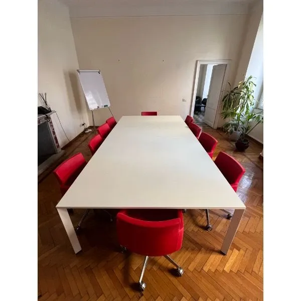 White table for Sinetica meeting room and set of ten red imitation leather armchairs image