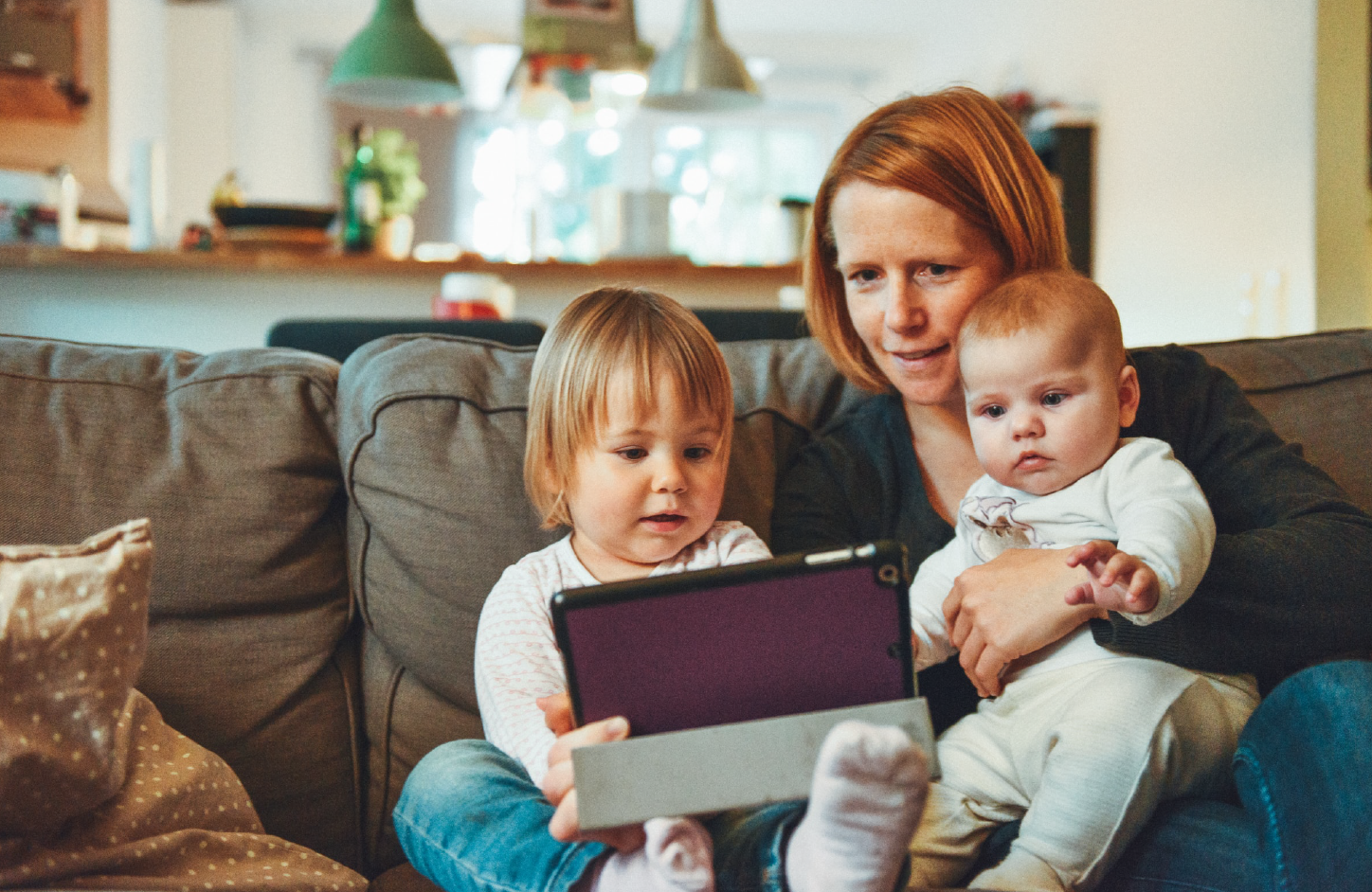 The promise of new beginnings: a young family sit together and enjoy each other’s company. 