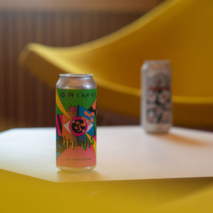 Two craft beer cans on a hexagon table