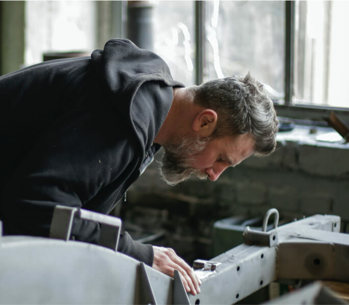 A man inspecting a machine