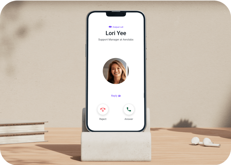A mobile phone showing an incoming call from the Dialpad app Ai Voice landing page