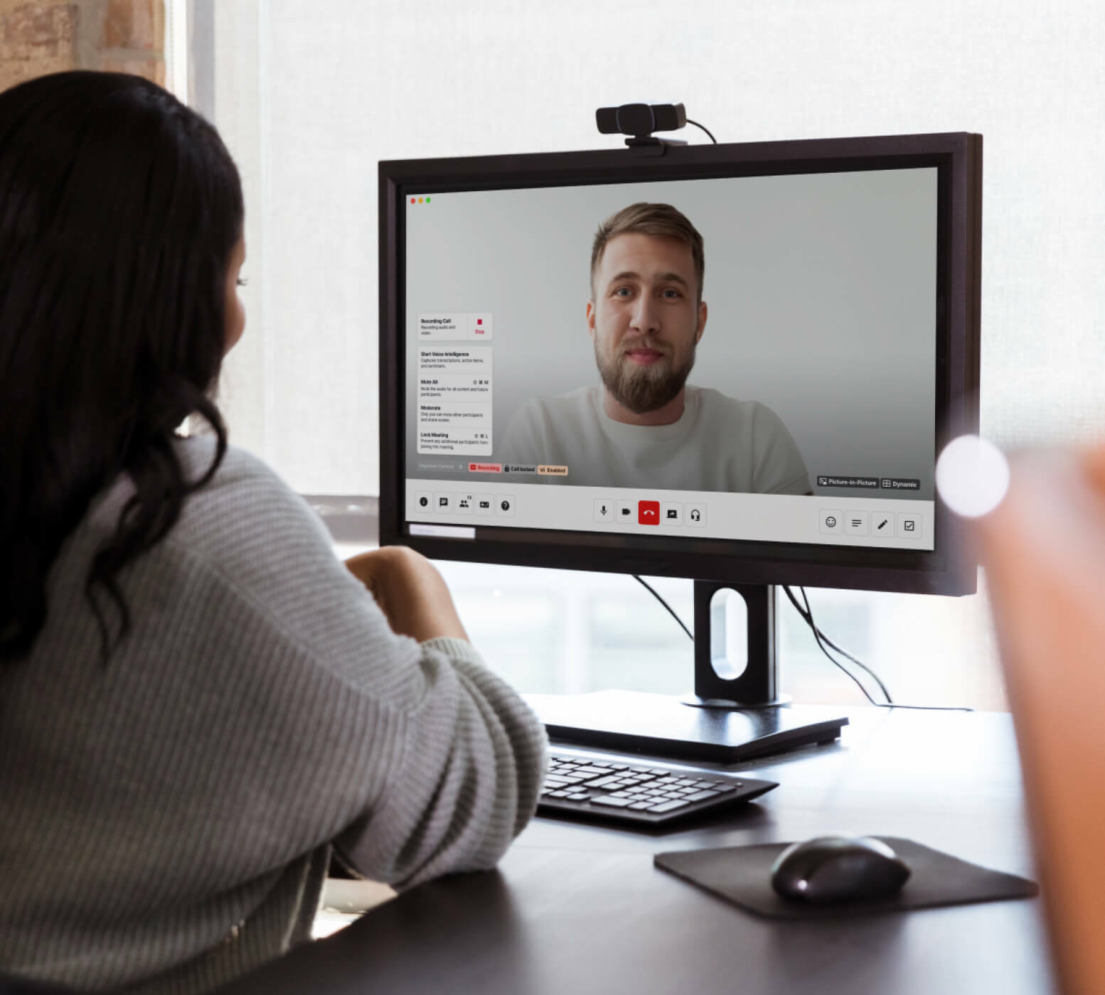 A person in a videoconference Dialpad versus Grasshopper