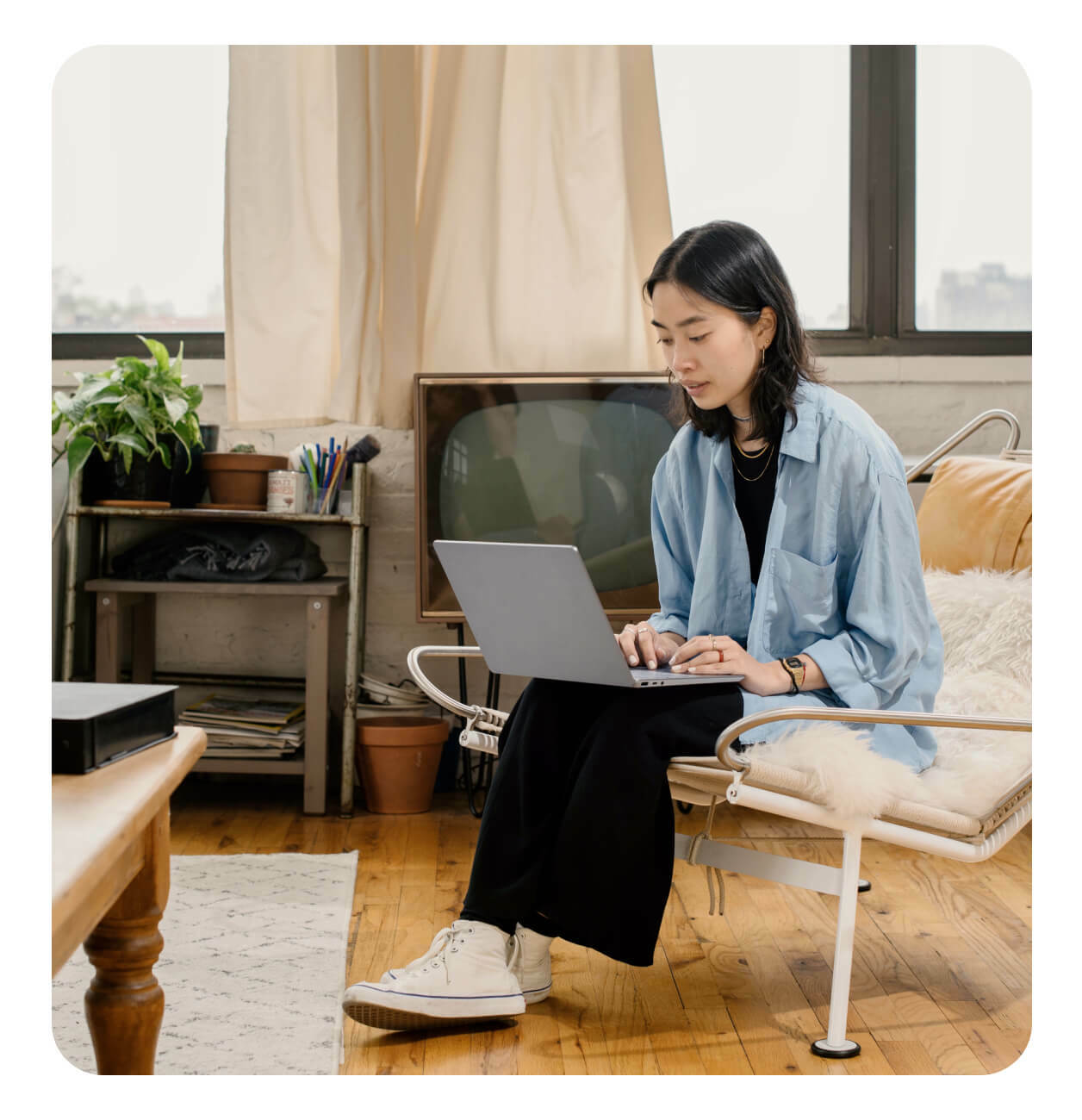 A person using her laptop - Contact us hero