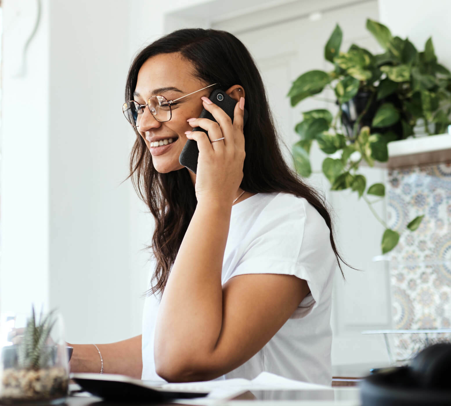 A person using her mobile device Dialpad versus Vonage