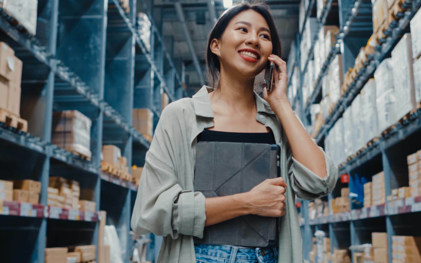 A woman inside a logistics warehouse