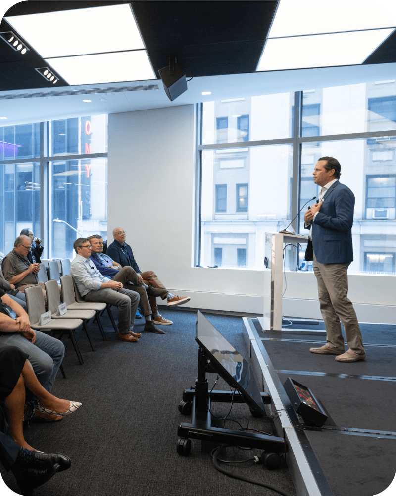 Craig Walker speaking at the AI Work City Tour