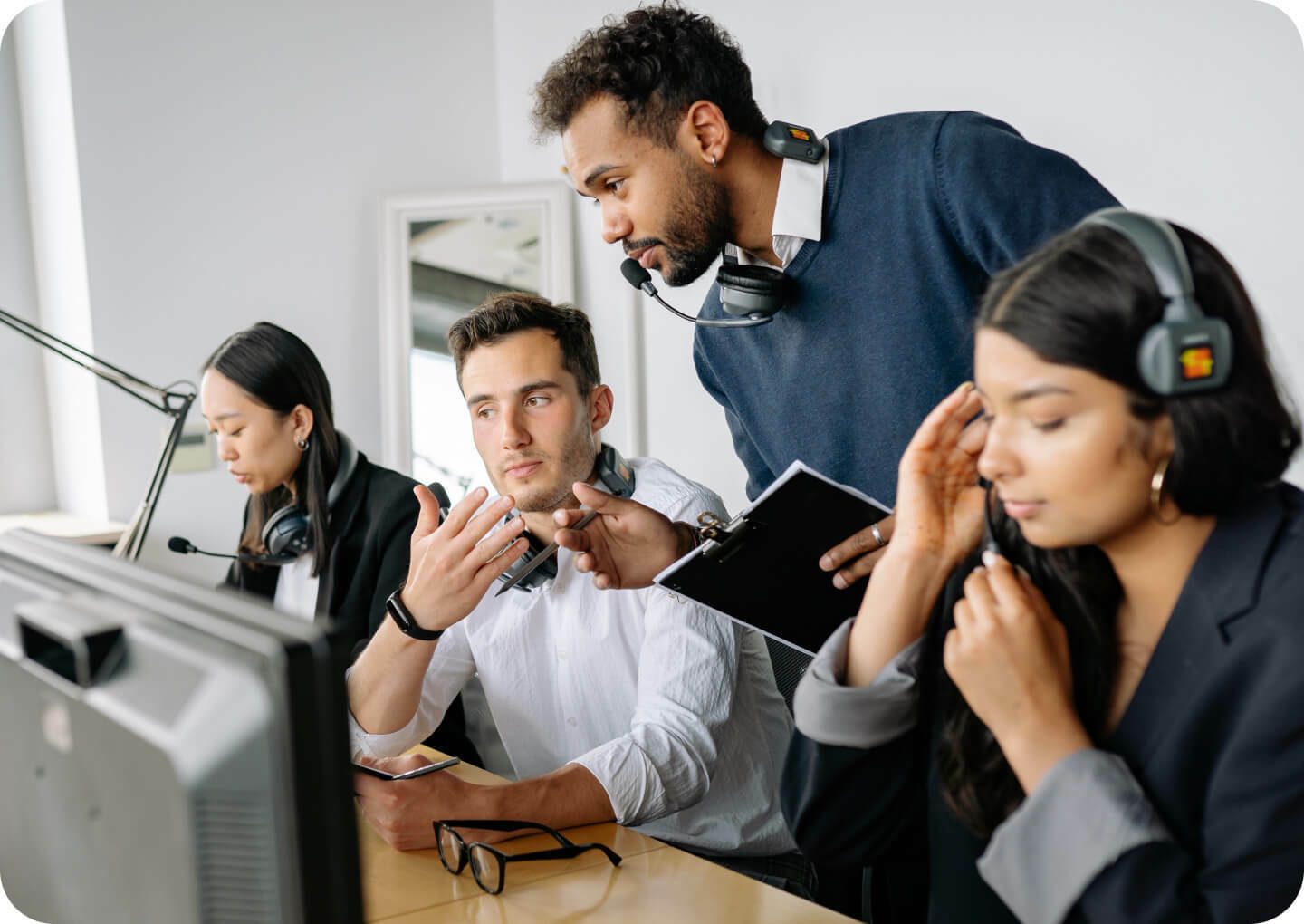 Four call center agents working at the office