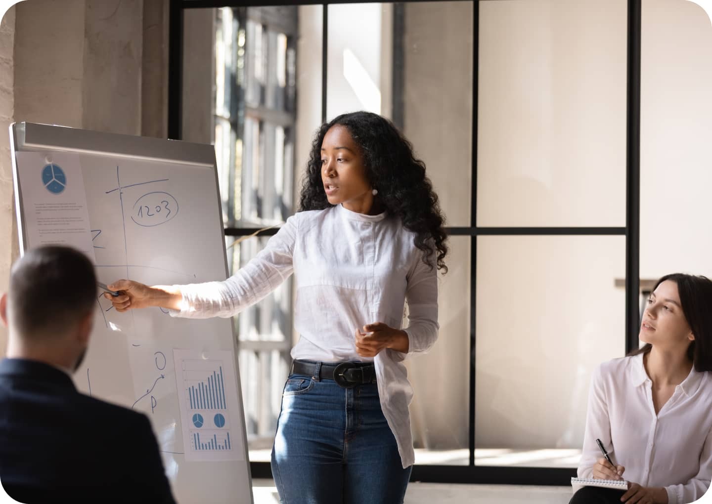 Three people discussing on a meeting