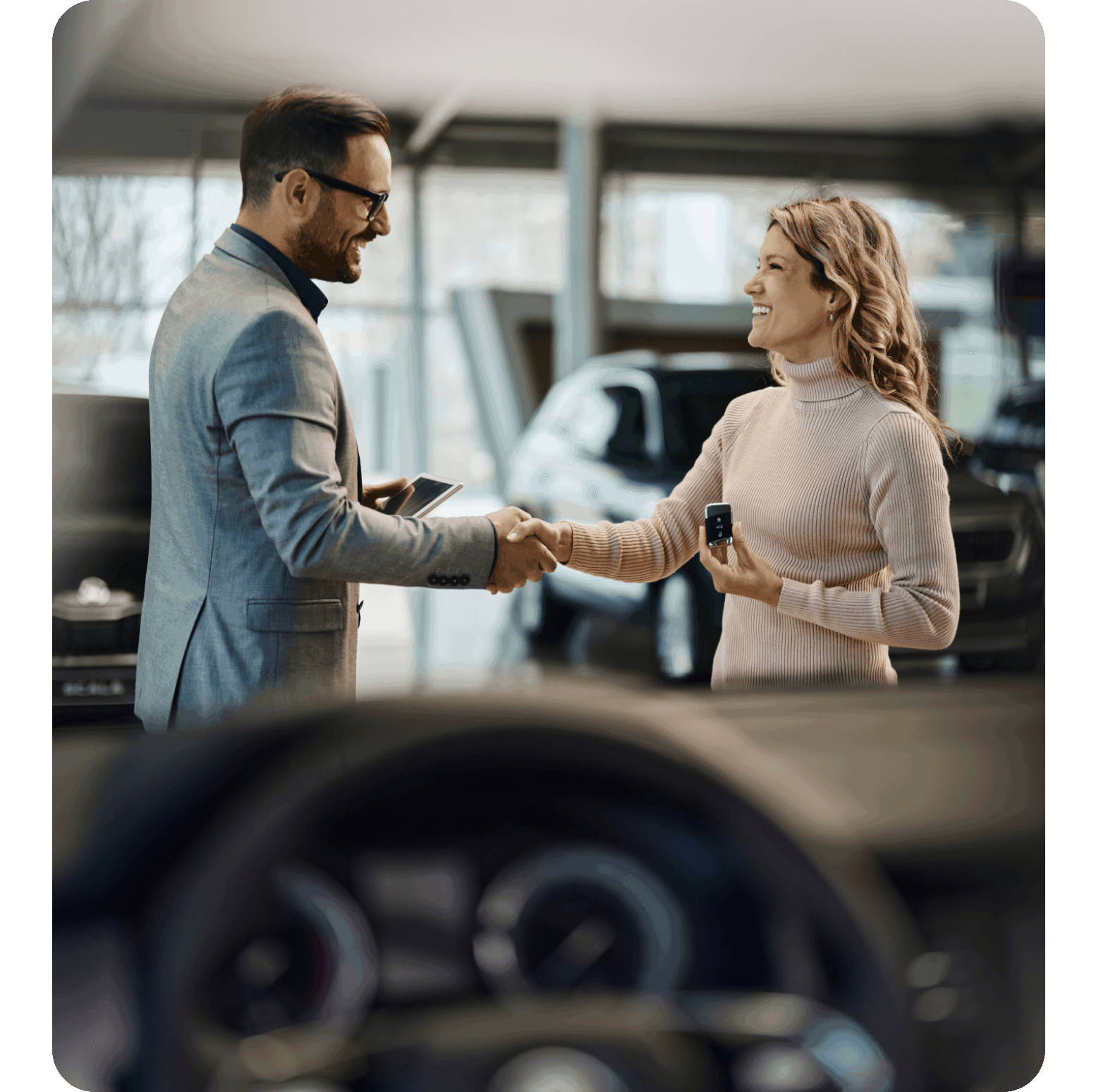 Two people shaking hands automotive industry