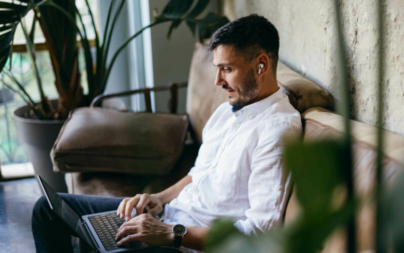 A guy working on the sofa
