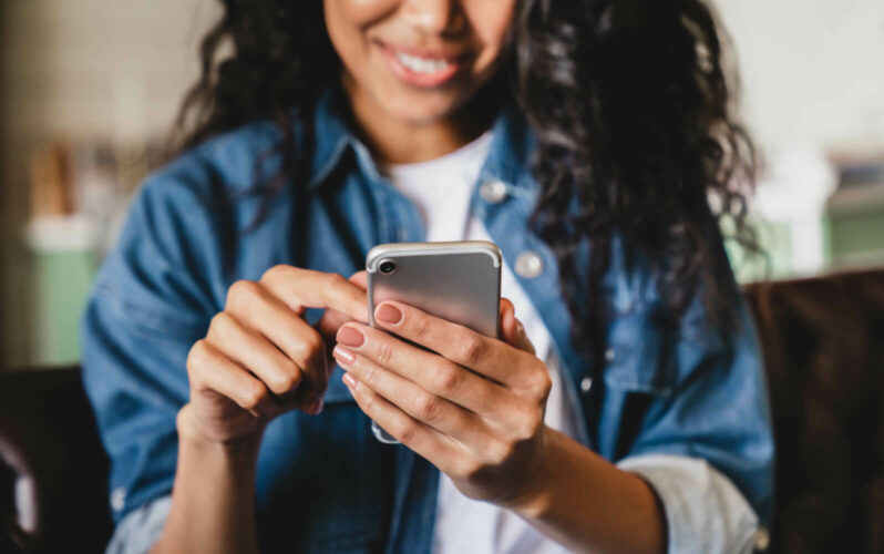 A person using a mobile device Miracle Messages