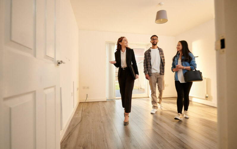 Real estate agents visiting a house