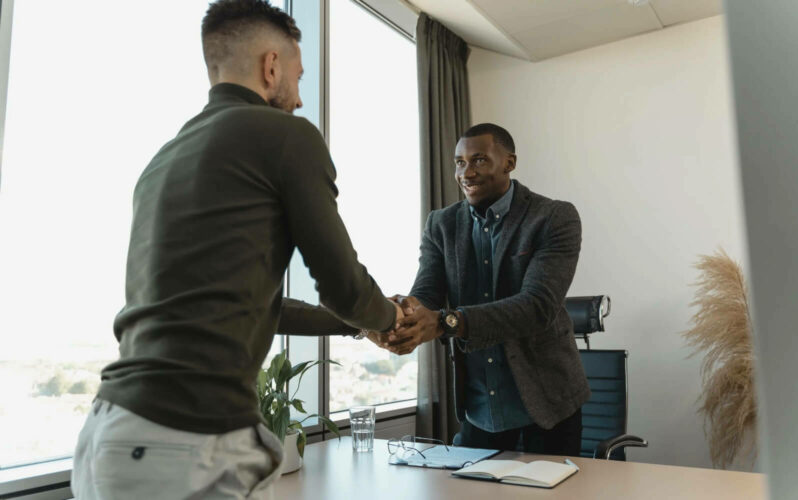 Two persons shaking hand Knock out recruiting