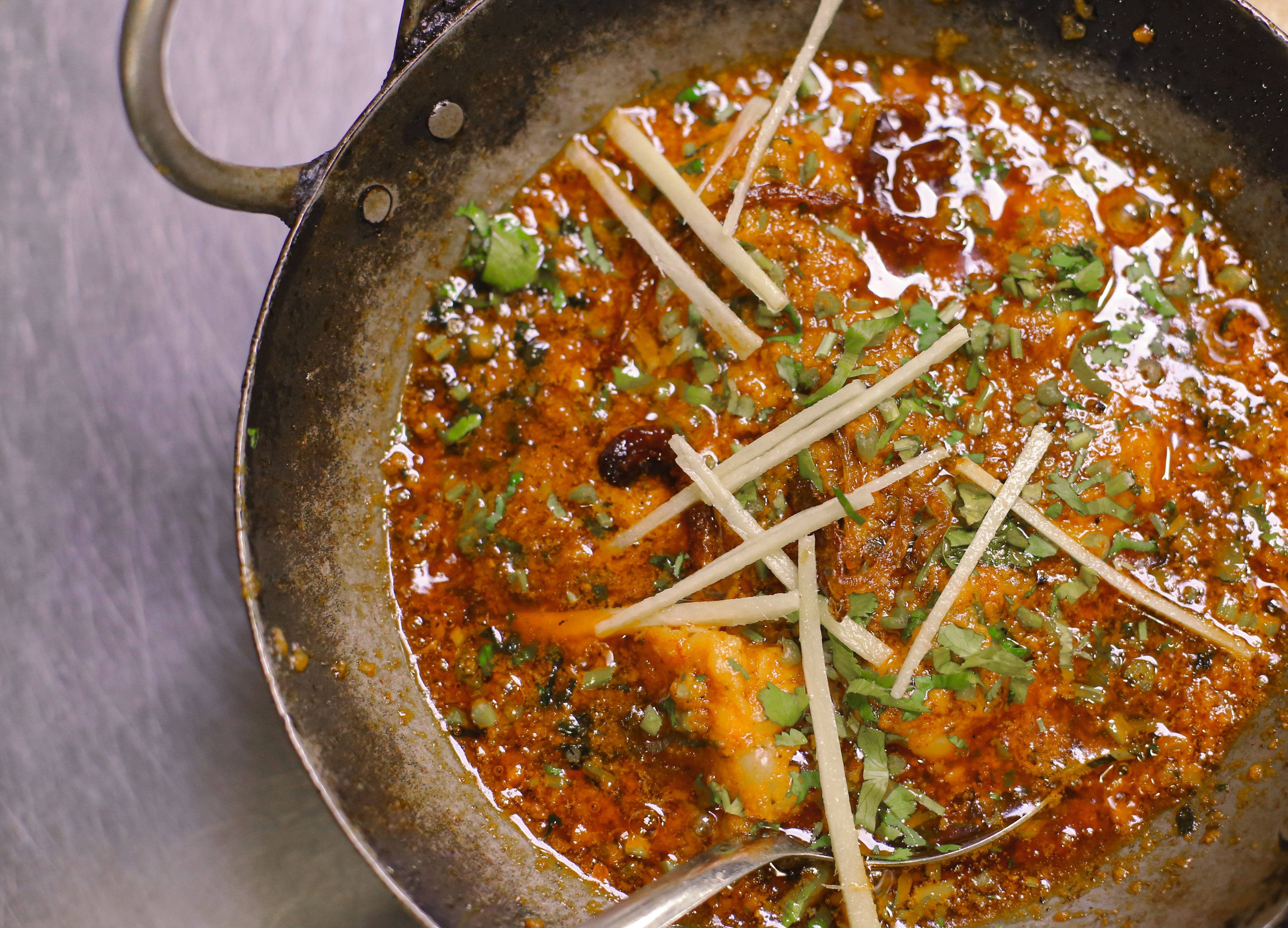 How do I order a spicy karahi dish in London?