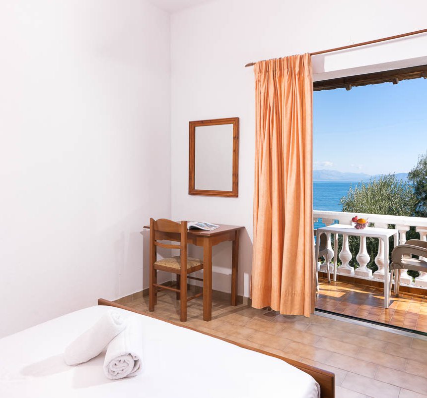 Dimitra Studios, bedroom with two beds and a balcony