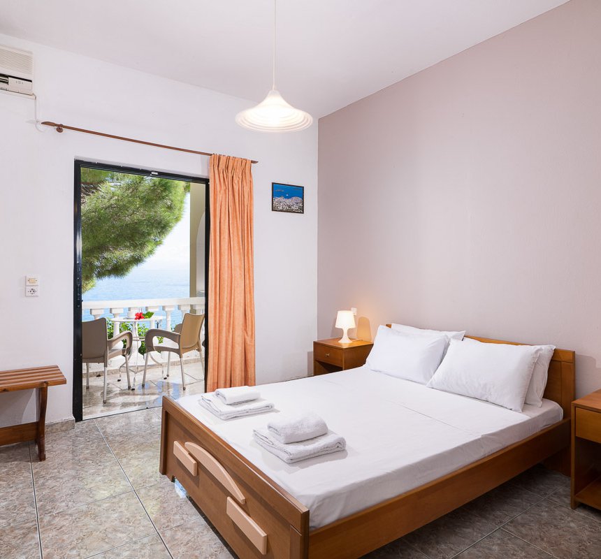 Dimitra Studios, bedroom with double bed and a balcony