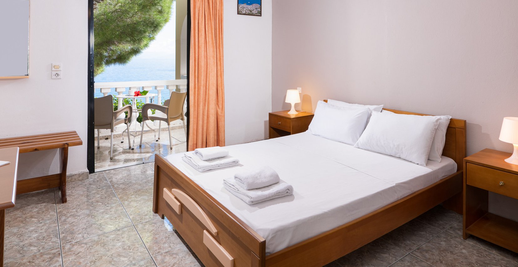 Dimitra Studios, bedroom with double bed and a balcony