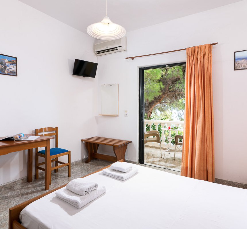 Dimitra Studios, bedroom with double bed and a balcony