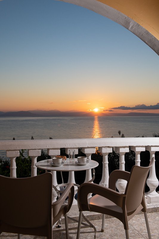 Dimitra Studios, balcony with a table and sea view