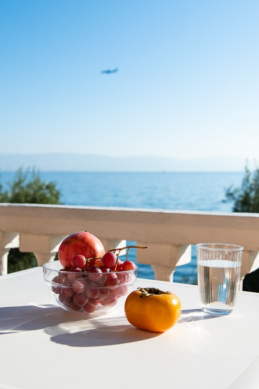 Dimitra Studios, balcony with a table and sea view