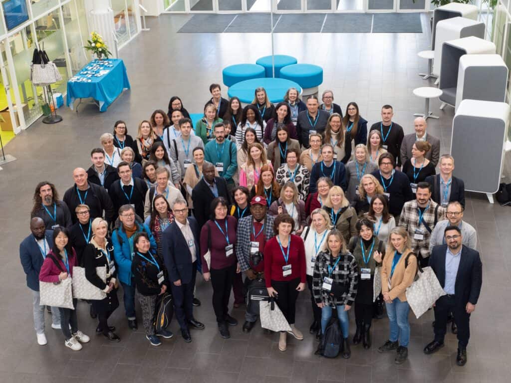 Participants at the DIVERSE conference in a modern, spacious venue promoting diversity and inclusion.