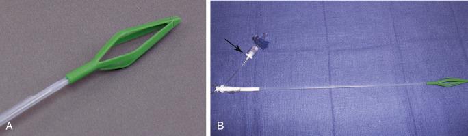 Fig. 14.14, (A) The Hunsaker Mon-Jet tube cage. (B) Hunsaker carbon dioxide sampling port (arrow) .