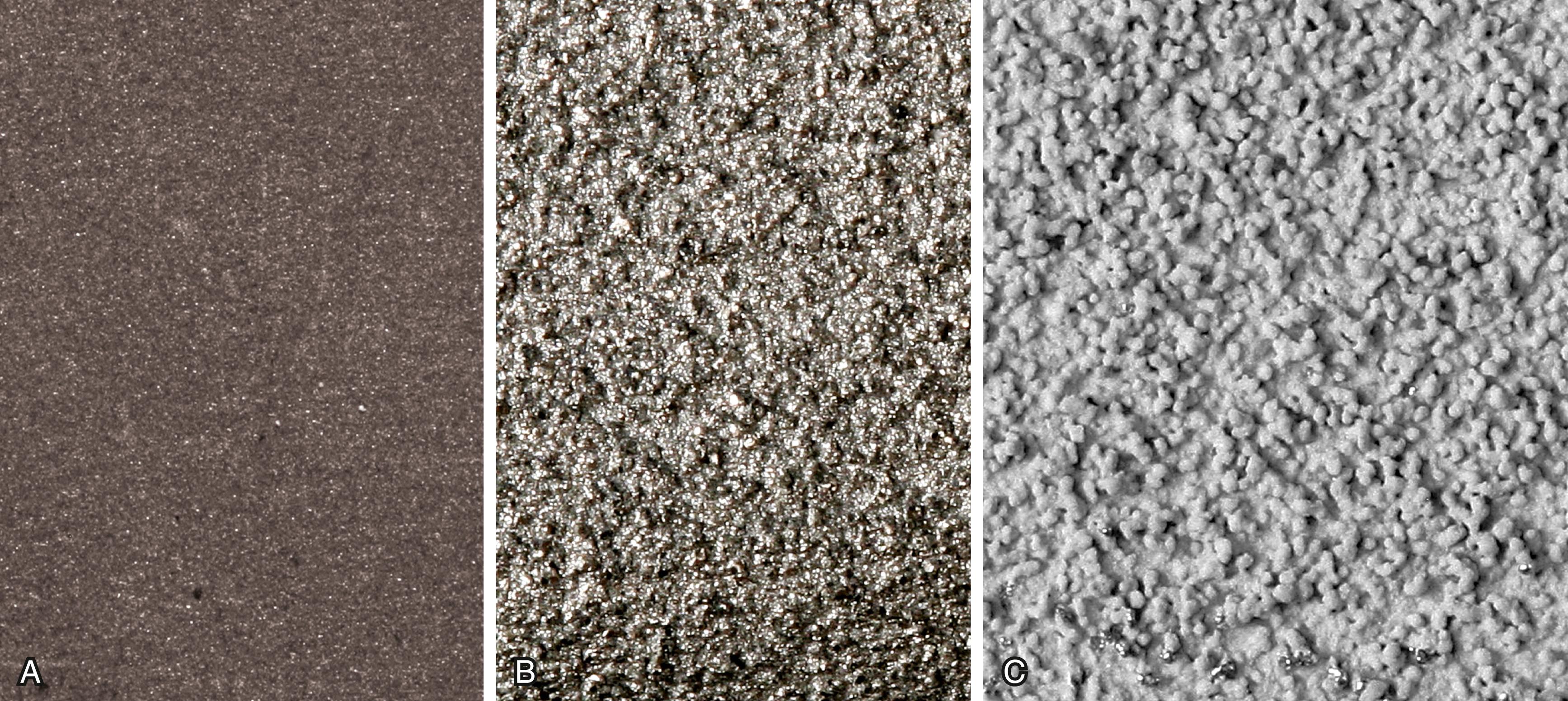 FIGURE 3.20, Types of bone ongrowth surfaces. A, Grit-blasted surface. More highly textured plasma-sprayed surfaces: titanium (B) and hydroxyapatite (C) .