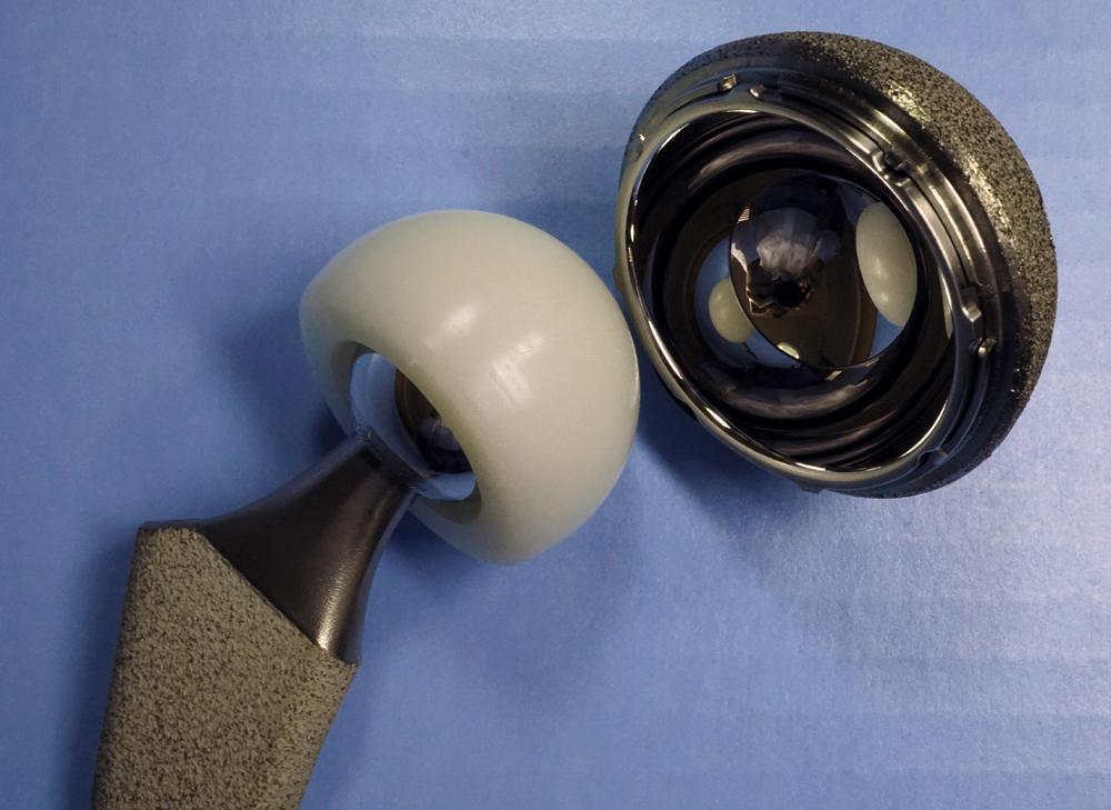 FIGURE 3.35, Dual mobility acetabular component. Porous-coated shell with polished interior, large polyethylene head, and smaller inner bearing.