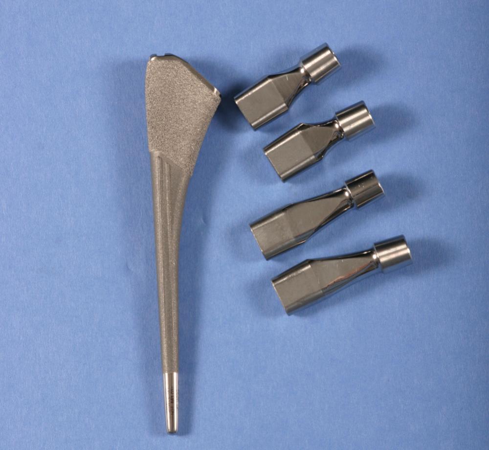 FIGURE 3.10, Modular femoral neck with taper junctions for stem body and femoral head. Multiple configurations allow independent adjustment of length and offset and version.