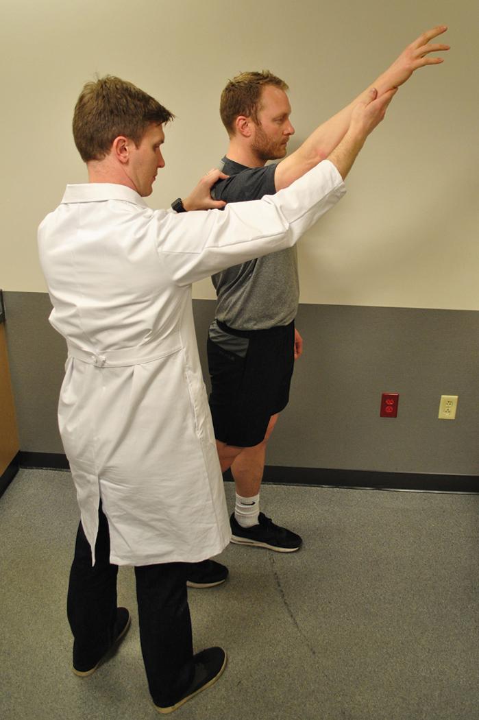 Fig. 9.5, Posterior instability test and dynamic posterior instability test are helpful for detecting posterior shoulder instability. The patient performs shoulder forward elevation and pushes to the floor with the elbow straight. Pain in the posterior shoulder is a positive test. The modification involves the examiner pushing with his or her thumb on the posterior humeral head, stabilizing it. Improvement in pain is typical.