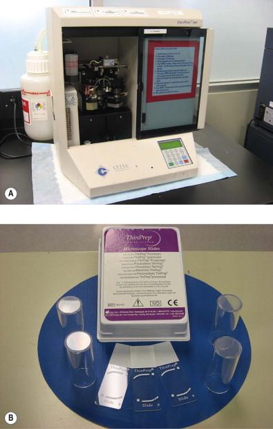Figure 35-4, (A) The ThinPrep T2000 device. This is the most commonly utilized ThinPrep device. It processes one preservative cell suspension vial at a time. (B) ThinPrep plastic filter/vortexing units and glass slides. Note the fiducial markings on the ThinPrep slide, which allow for accurate localization of fields of view when used with the ThinPrep Imaging System.