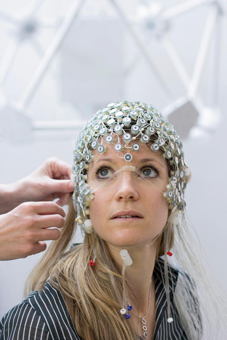 FIGURE 111.6, Published photograph of model wearing a brain-computer interface device developed by Dr. Birbaumer’s team.